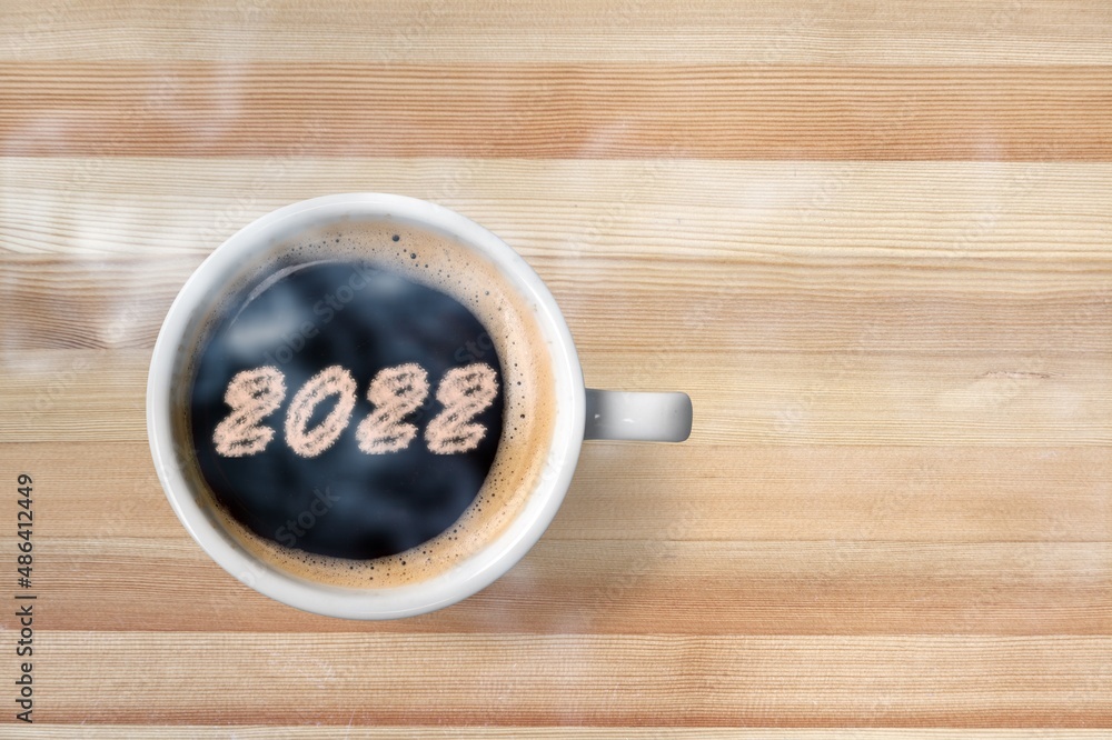 Number 2022 on the surface of cappuccino served in cup