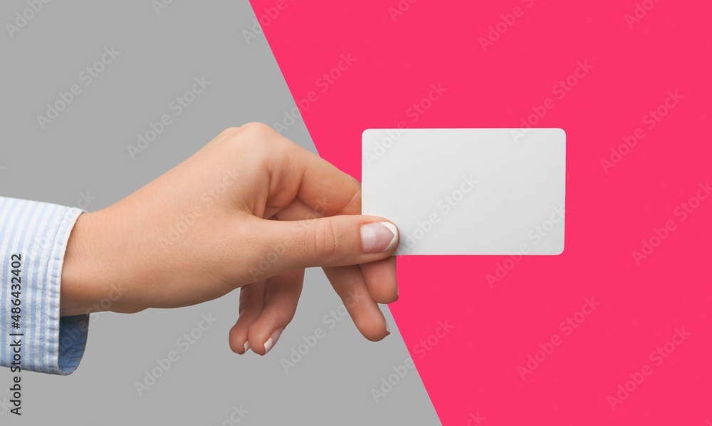 Young female hand and template Bank credit card with online service on background