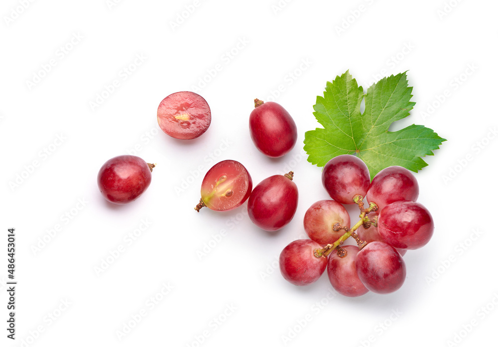 Flat lay (top view) of red grape with leaves on white background.