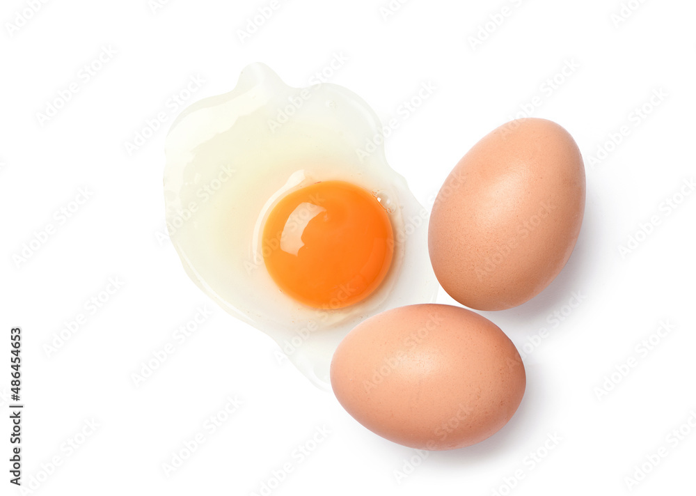 Flat lay of chicken eggs and egg yolk isolated on white background.