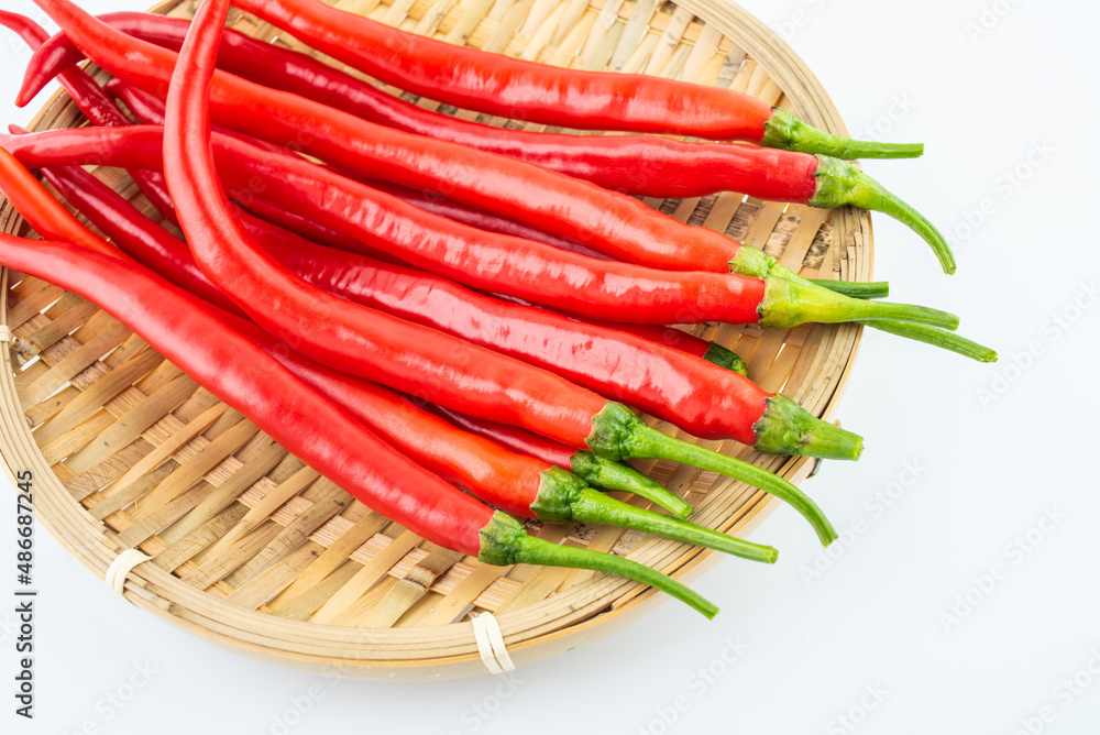 Fresh red peppers on white background