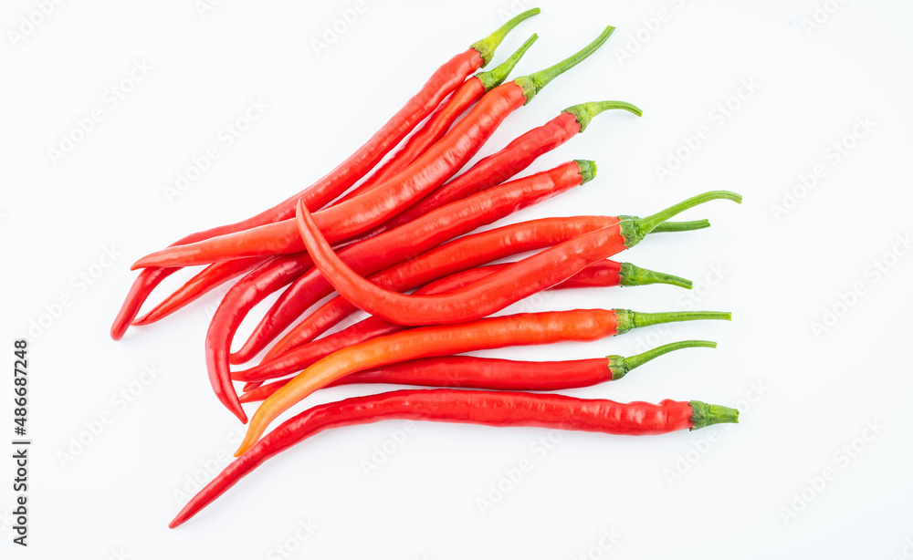 Fresh red peppers on white background