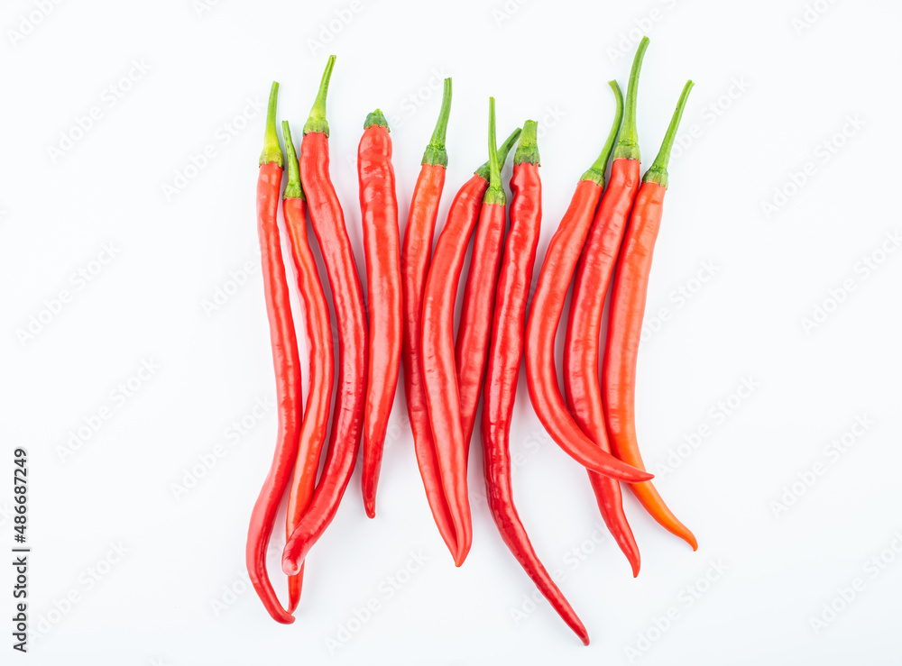 Fresh red peppers on white background