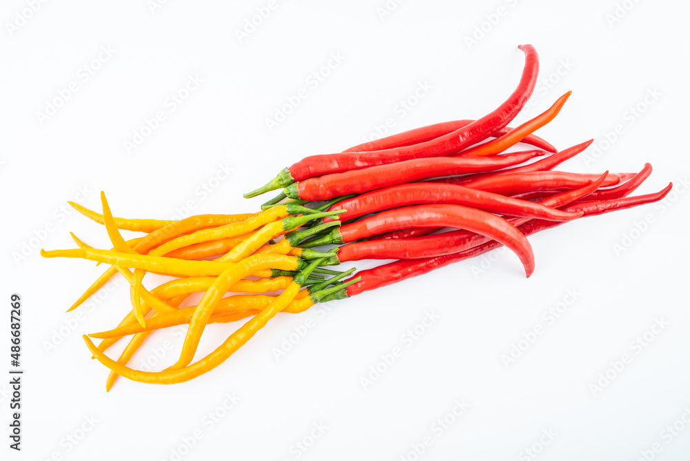 Fresh yellow and red peppers on white background