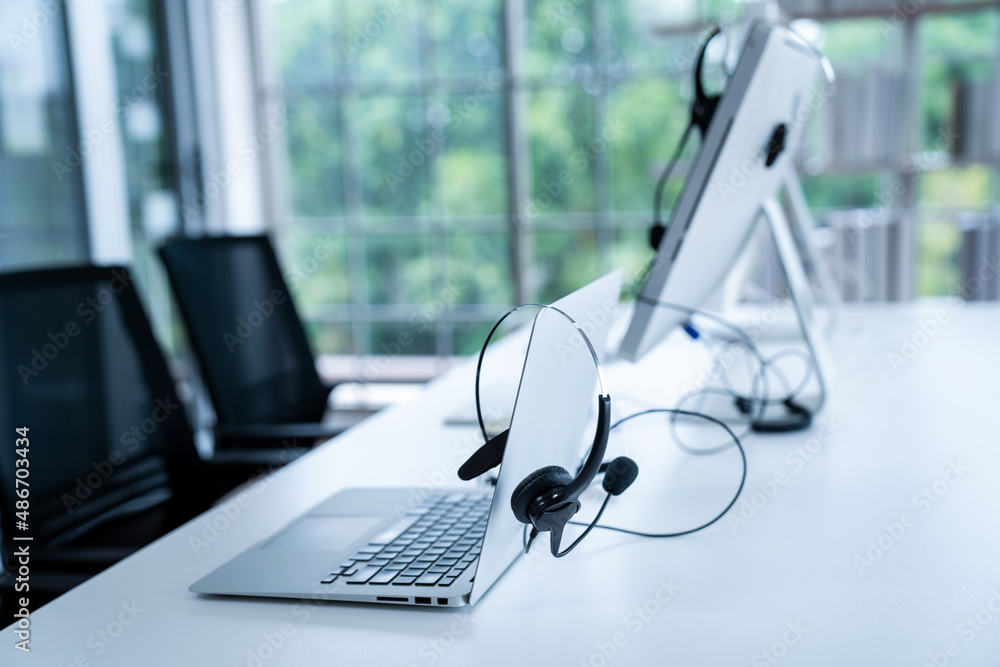 Headset and customer support equipment at call center ready for actively service . Corporate busines