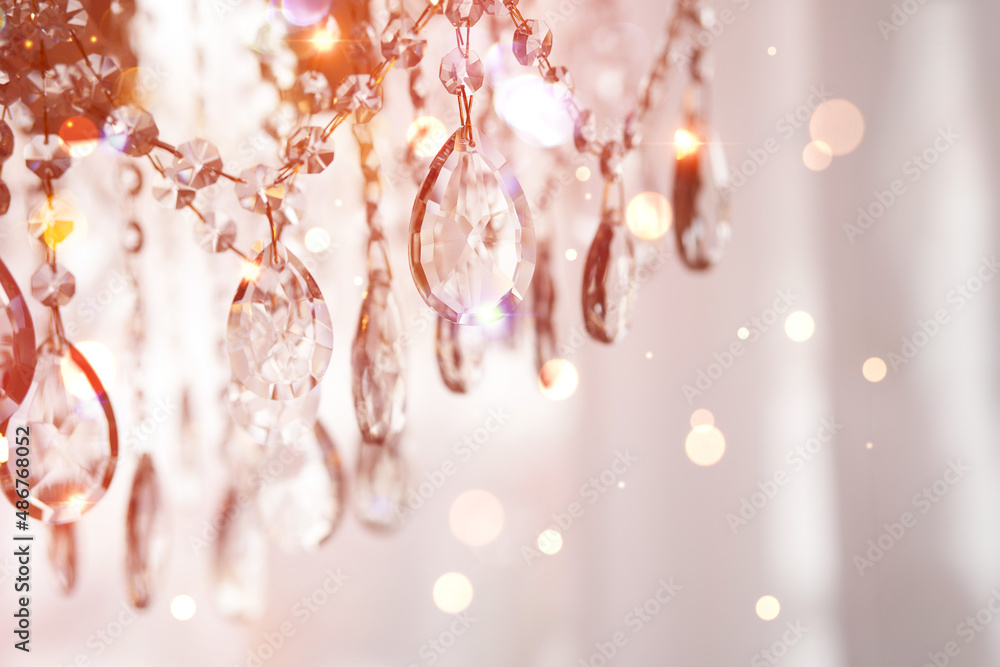 Crystal chandelier in room interior. Crystal chandelier with bokeh effect