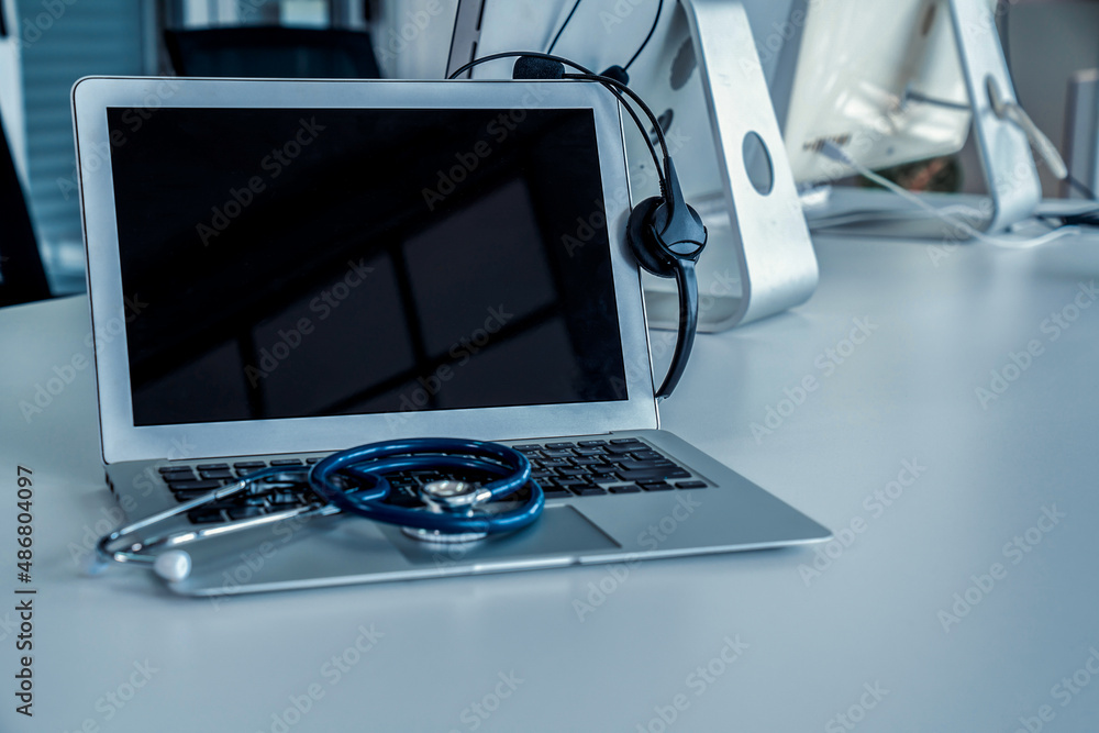 Headset and doctor equipment at clinic ready for actively support for patient by online video call .