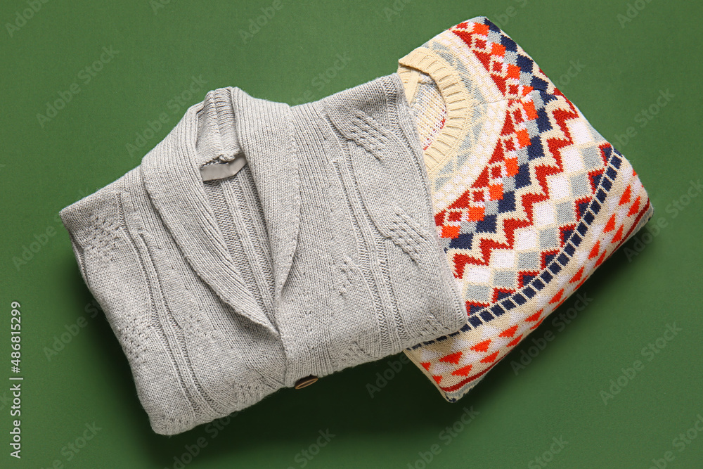 Sweaters with stylish pattern on green background