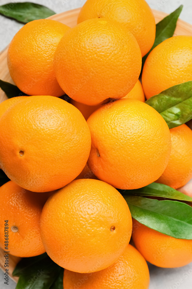 Fresh juicy oranges on table, closeup