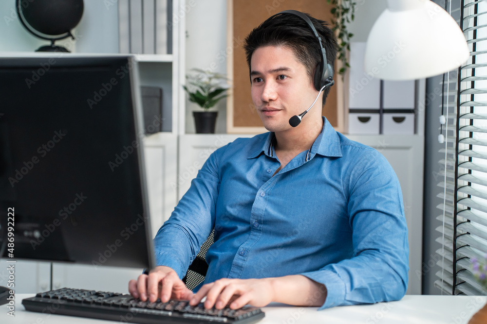 Asian handsome business man using laptop computer working in office. 