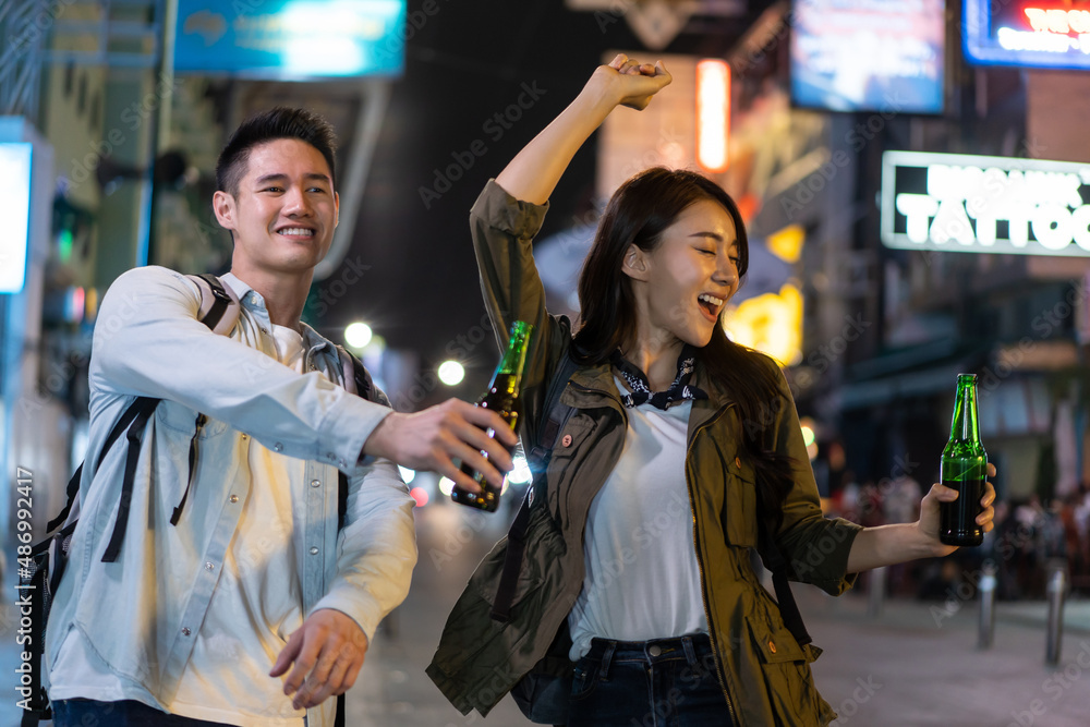 Asian attractive couple drinking alcohol and having party together. 