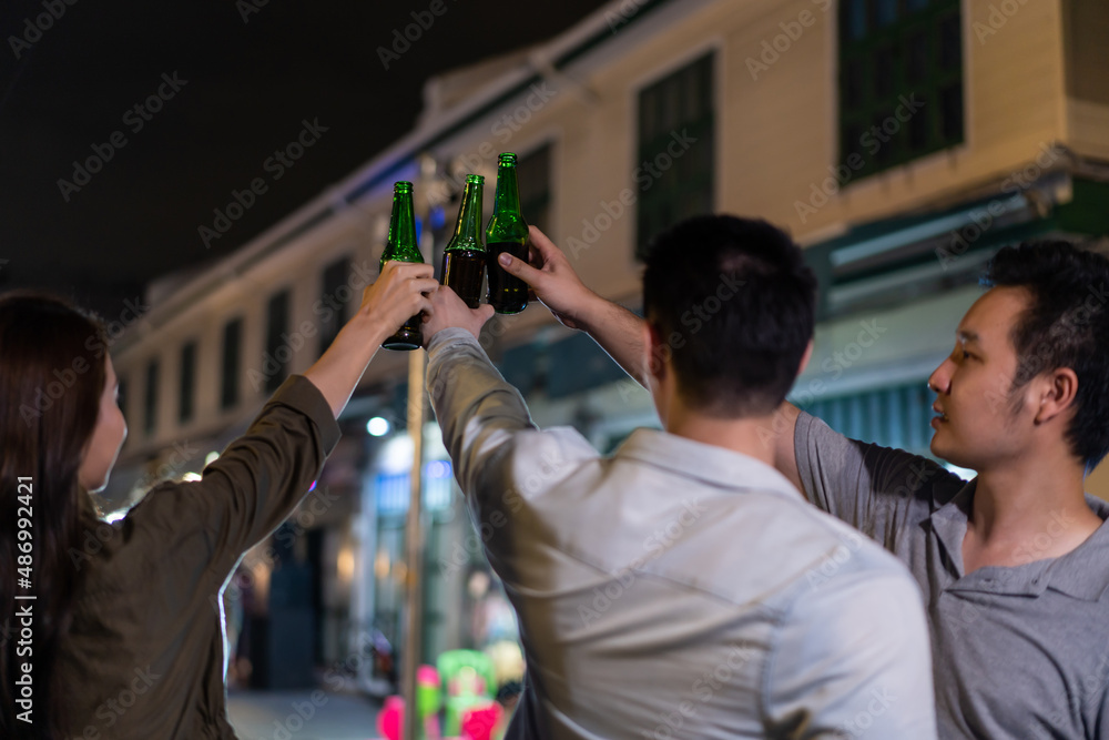 Asian attractive people drinking alcohol with friends and having party. 