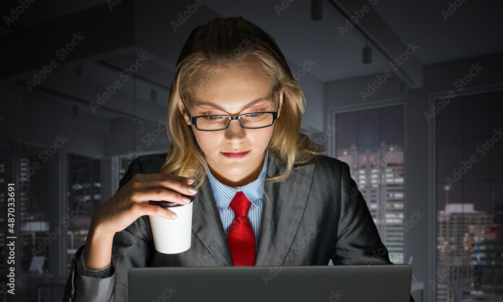 Young businesswoman sitting at desk