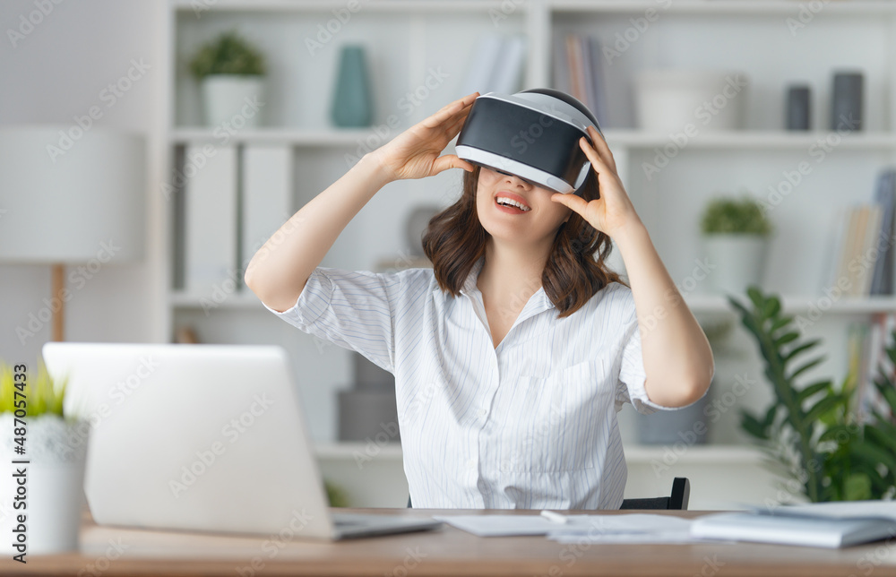 Woman with VR virtual reality goggles