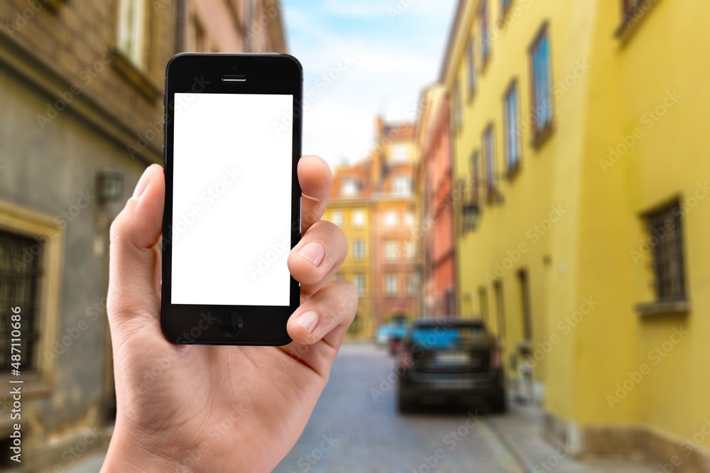 Business and financial concept. Hand with smartphone with a blank screen