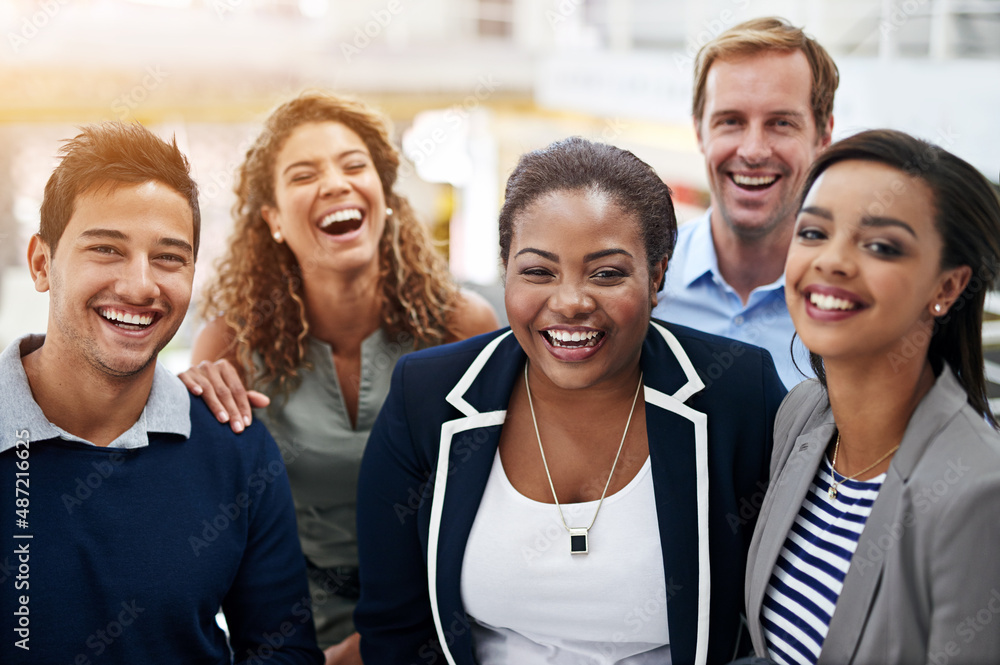 Together, we can achieve so much. Portrait of a group of smiling coworkers standing in an office.