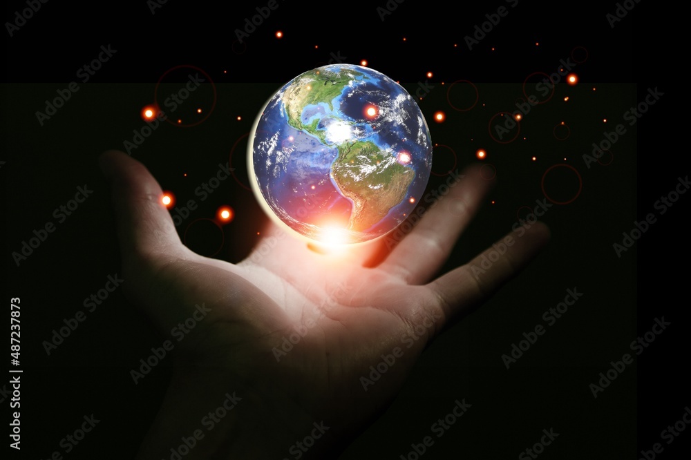 Earth in human hands. energy saving , elements of this image furnished by NASA