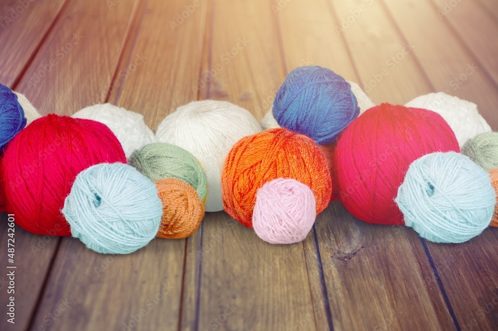 Cones of colored cotton, woolen or synthetic threads. Bobbins in textile manufacturing