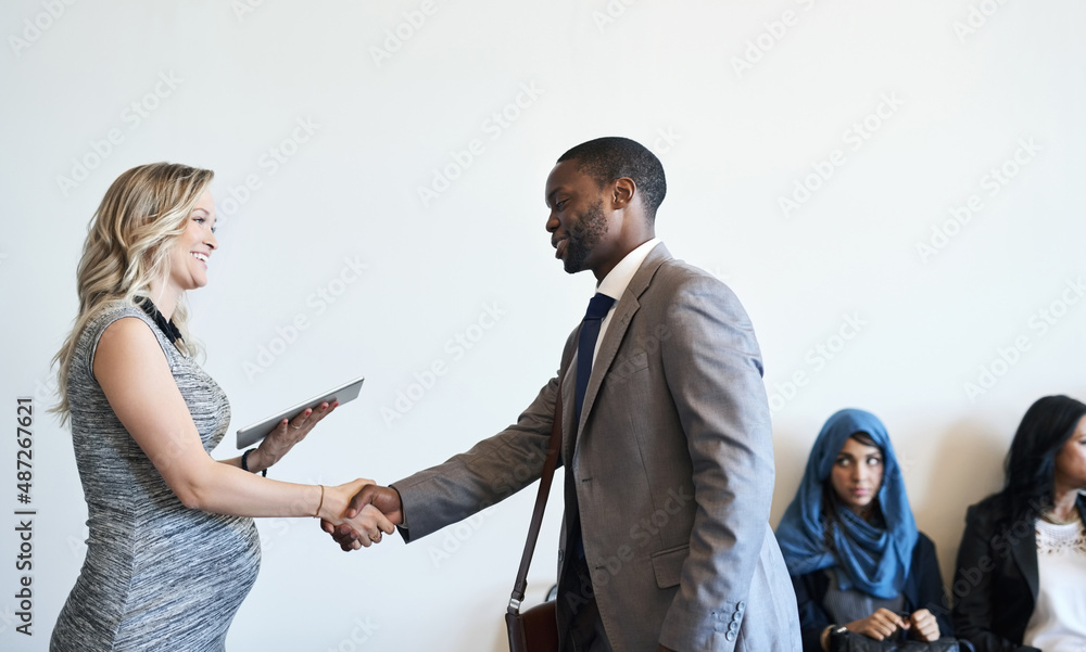 Its so good to finally meet you. Shot of a well-dressed candidate shaking hands with his interviewer