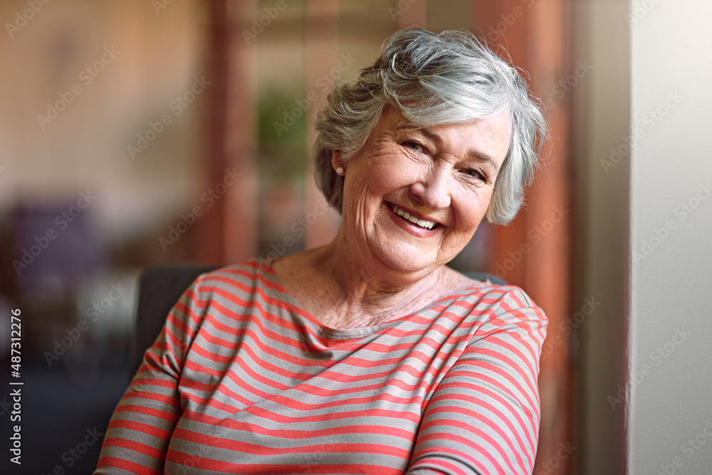 I see no good reason to act my age. Shot of a senior woman relaxing at home.