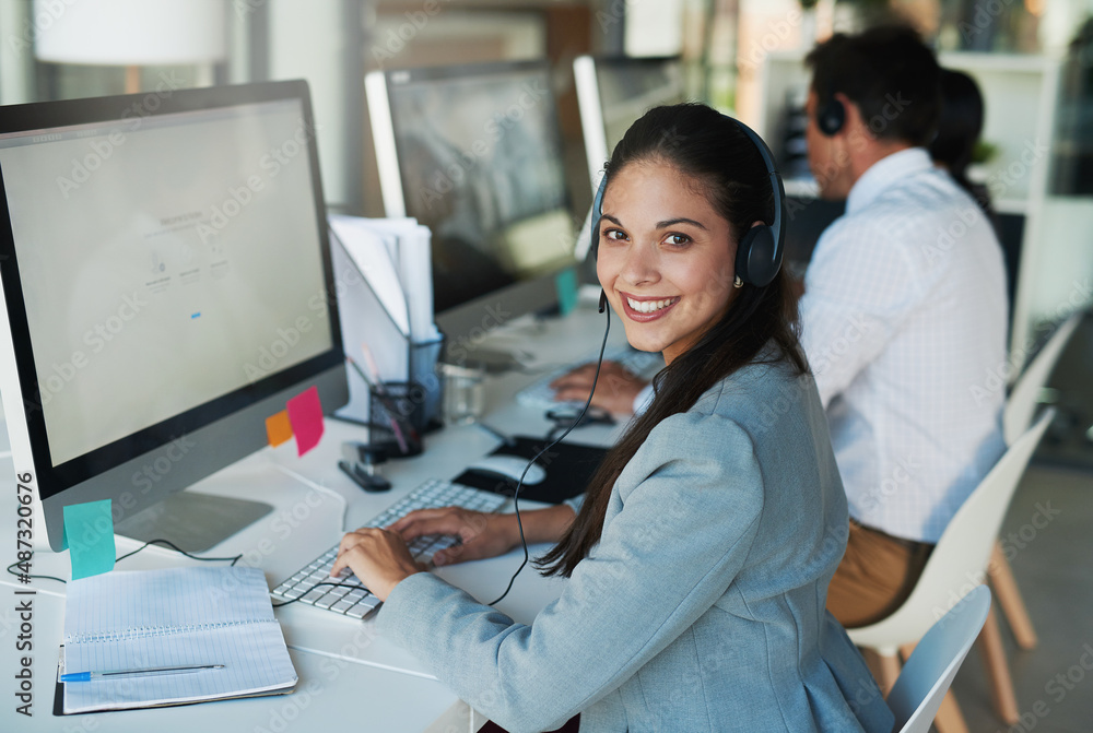 Her clients appreciate her friendly demeanor. Portrait of a happy and confident young woman working 