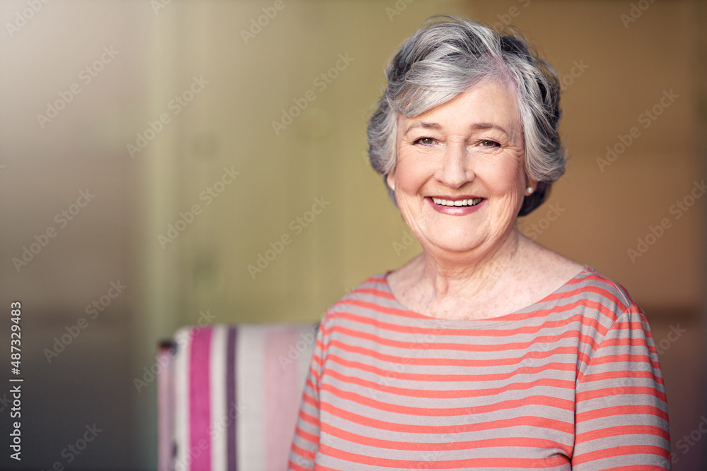 I have every reason to be happy. Shot of a senior woman relaxing at home.