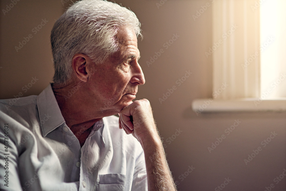 I wish you were here. Shot of a senior man looking thoughtful.