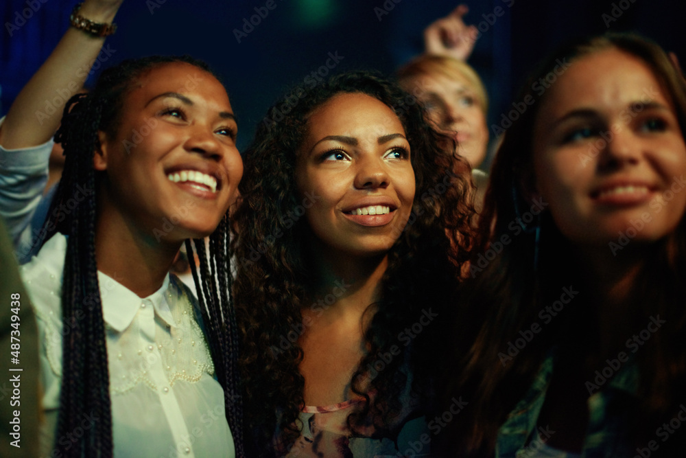 Captivated by the music. Audience members at a concert.