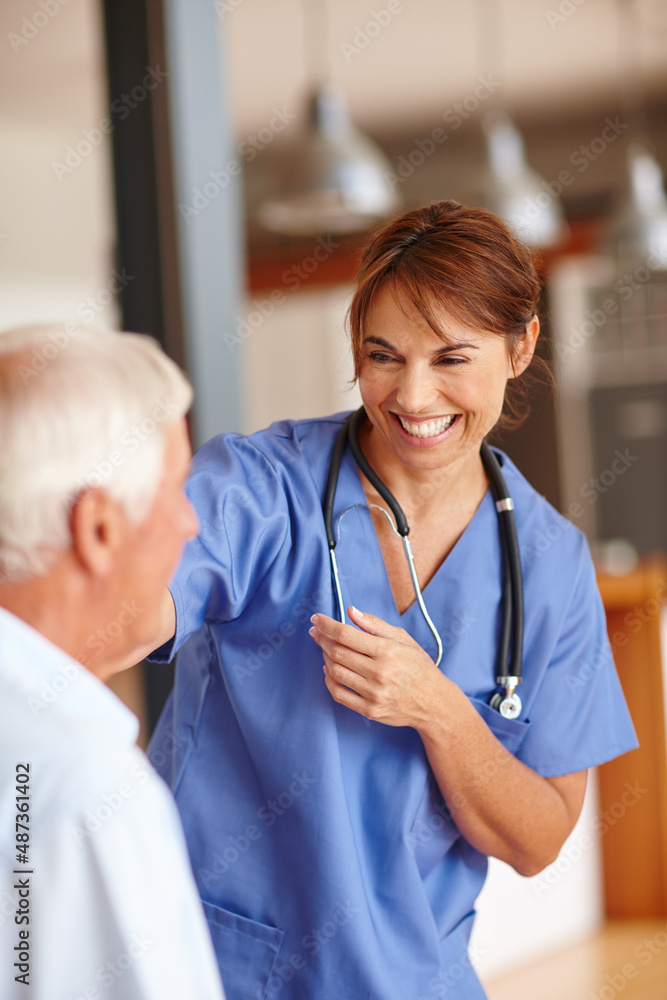 Shes got an excellent bedside manner. Cropped shot of a female nurse checking on her senior patient.