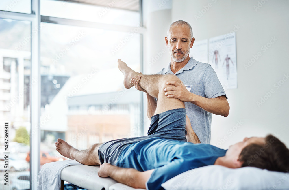 Well focus on your legs today. Shot of a physiotherapist treating a patient.