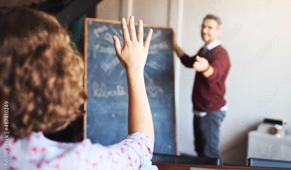 Dont be afraid to ask questions. Shot of an unrecognizable woman raising her hand to ask a question 