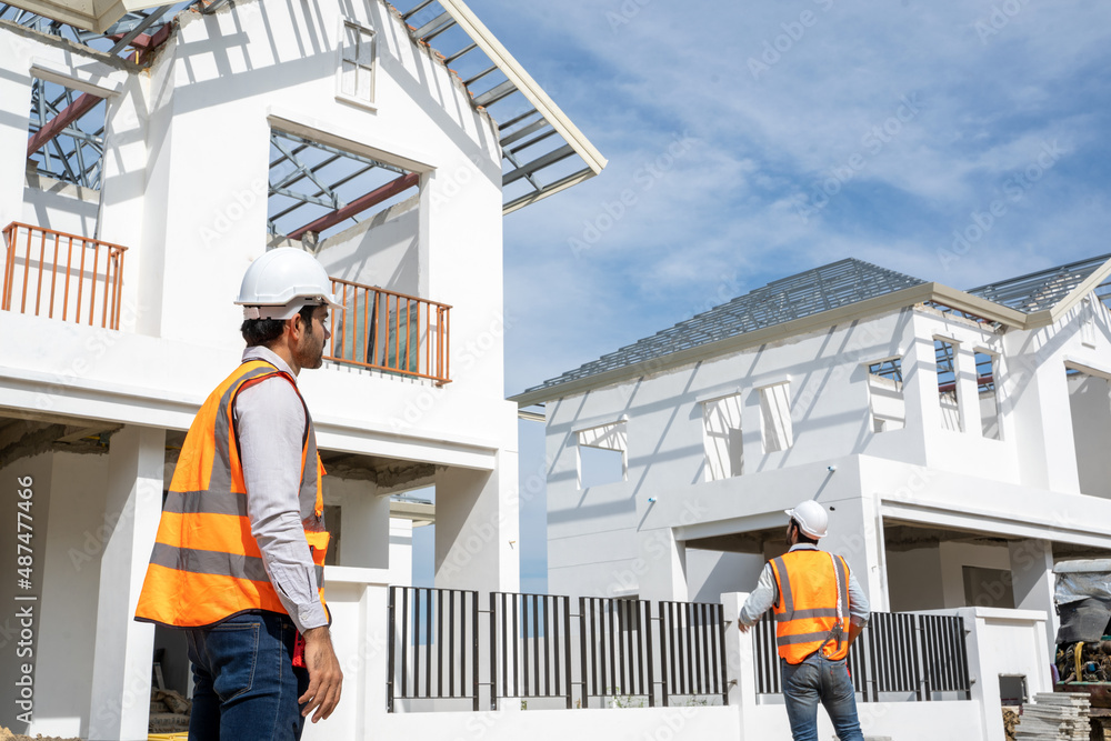 Group of construction engineers working together in construction site planning for new house,House i