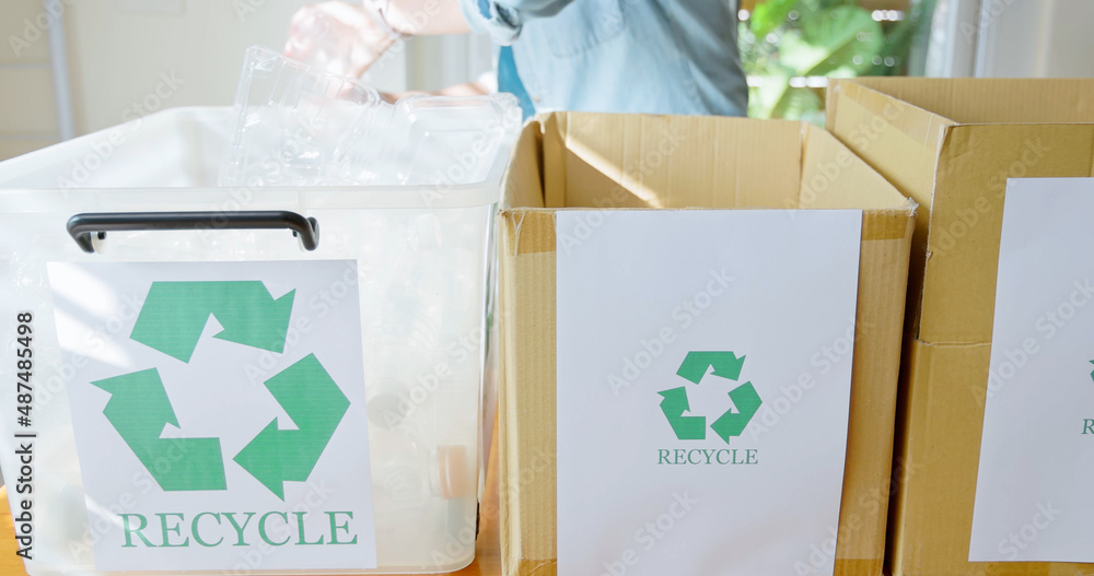 woman is recycling at home