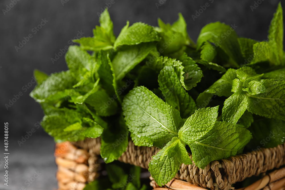 Wicker basket with mint on table