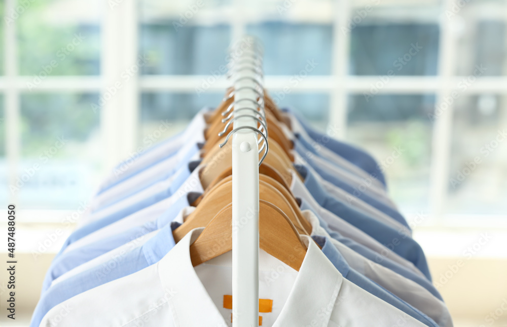 Rack with clean shirts after dry-cleaning