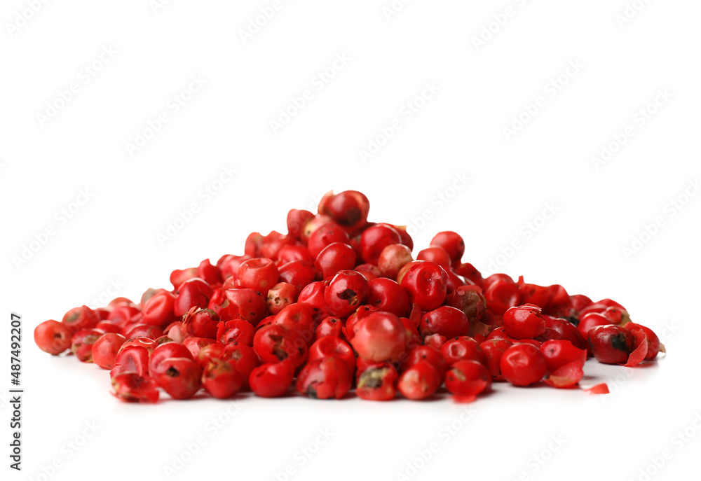 Heap of red peppercorns on white background