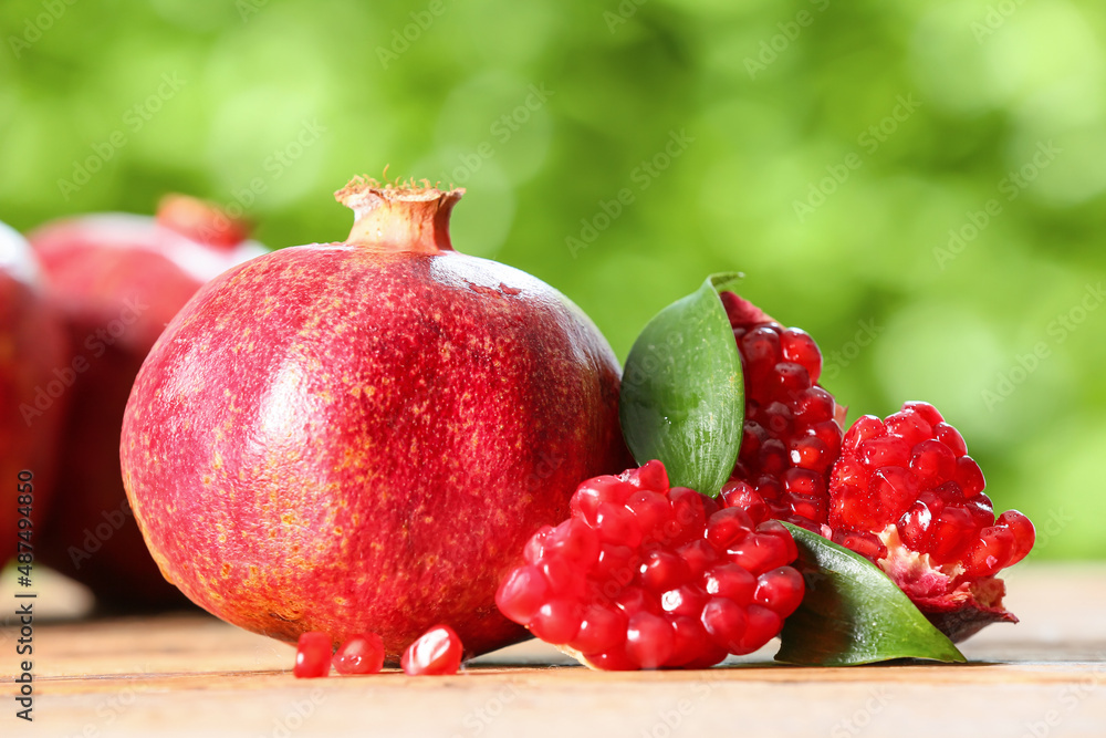 Ripe delicious pomegranate on table outdoors, closeup