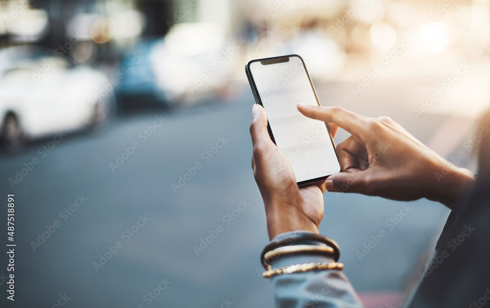 Have your say wherever you go. Closeup shot of a businesswoman using a cellphone in the city.