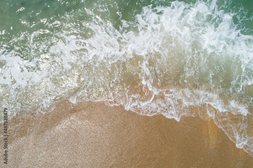 Aerial view sandy beach and waves Beautiful tropical sea in the morning summer season image by Aeria