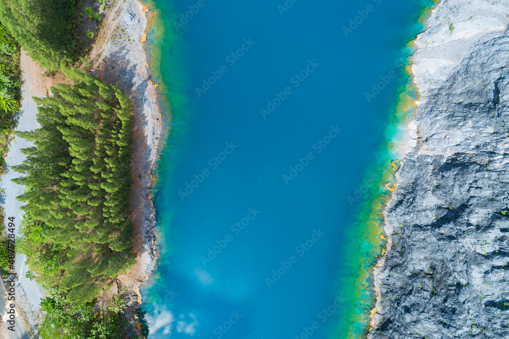 Aerial view of amazing pond in tropical rainforest forest with mountain rocks peak Beautiful water s