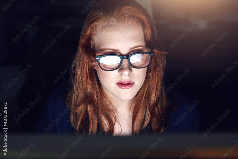 I only have so much room on my plate. Shot of a young businesswoman working late in her office.