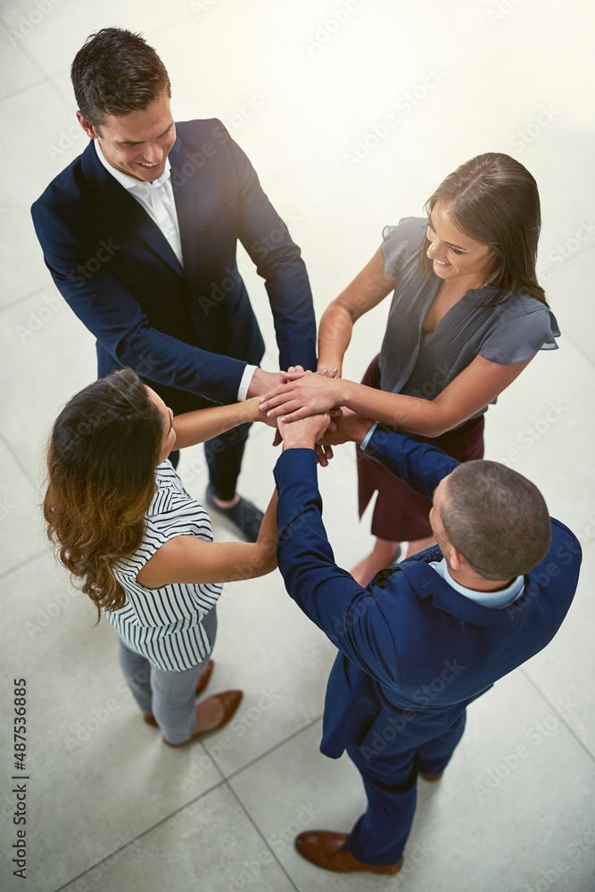 Teamwork is one of the greatest components of success. High angle shot of a group of businesspeople 