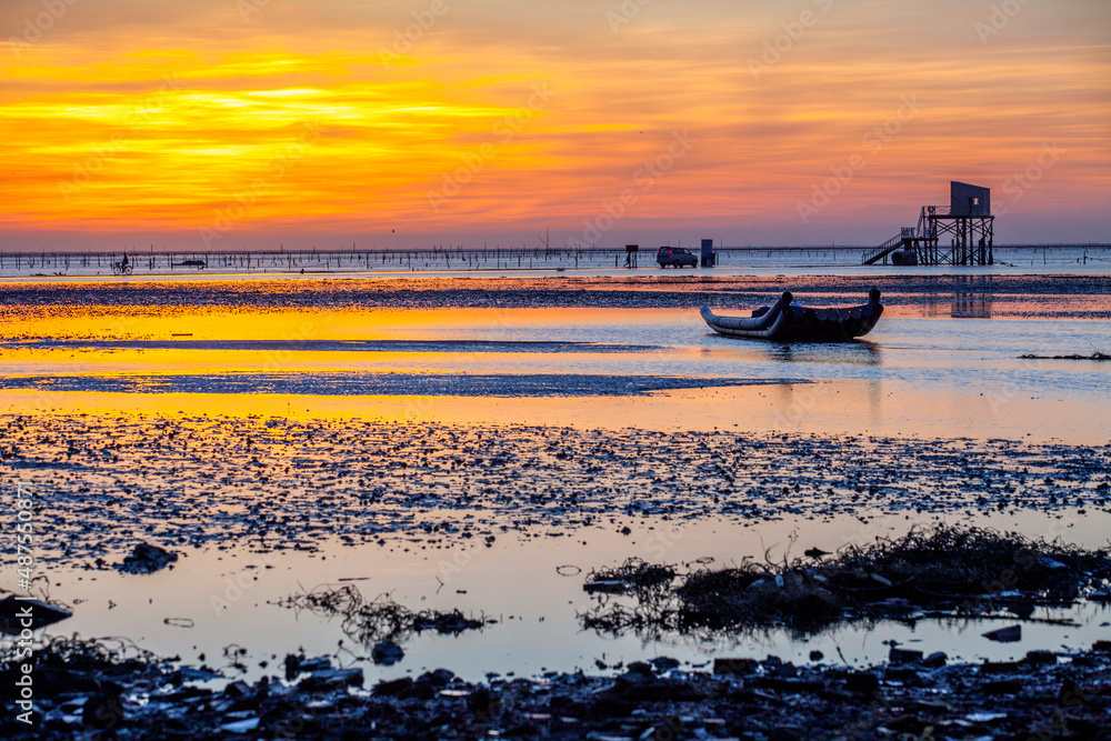 Beautiful landscape of sea level reflect fantasy dramatic sunset sky in wetlands , the famous travel