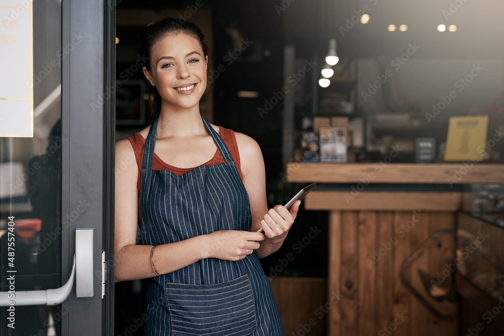 Share your passion for coffee with everyone else. Portrait of a confident young woman standing in th