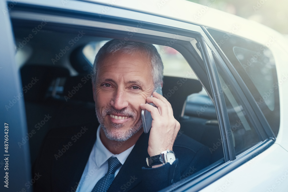 Technology fit for the man on the move. Shot of a businessman answering his cellphone while sitting 