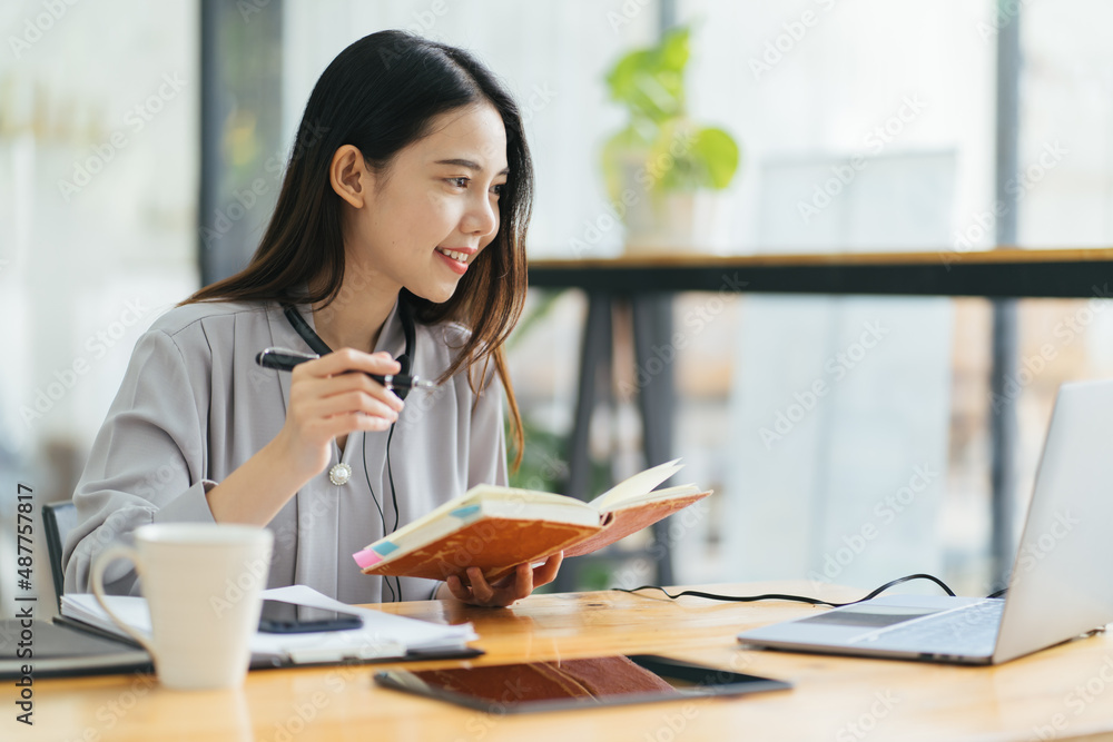 Beautiful Young Freelancer Woman Using Laptop Computer Sitting At Cafe Table. Happy Smiling Girl Wor