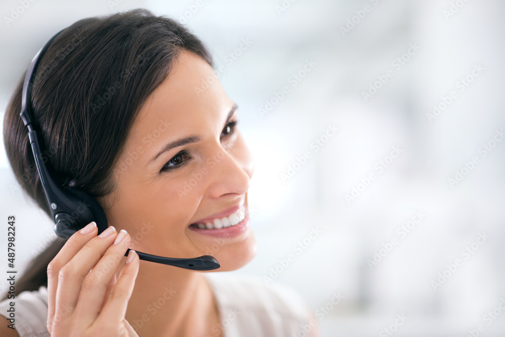 She goes the extra mile for her clients. Shot of an attractive customer support agent.