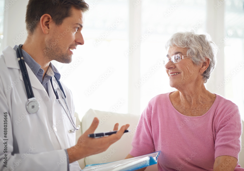 Youre in good health. Shot of a male doctor explaining something to his senior patient.