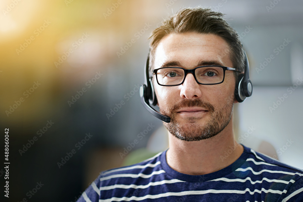 How may I direct your call. Cropped portrait of a businessman wearing a headset.