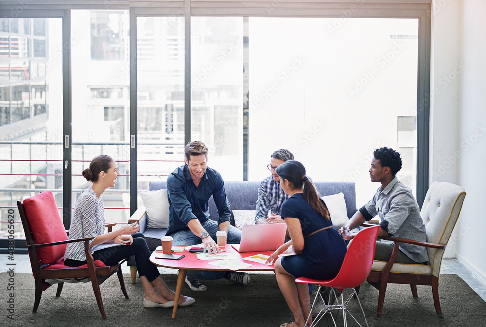 Their space for ideas. Shot of a group of coworkers in a meeting in an office.